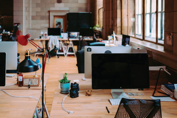 Empty office with computer desks and chairs